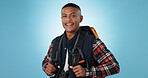 Man, portrait and backpack in studio as student for university, study education on blue background. Black person, face and smile for college knowledge or future learning, scholarship or mockup space
