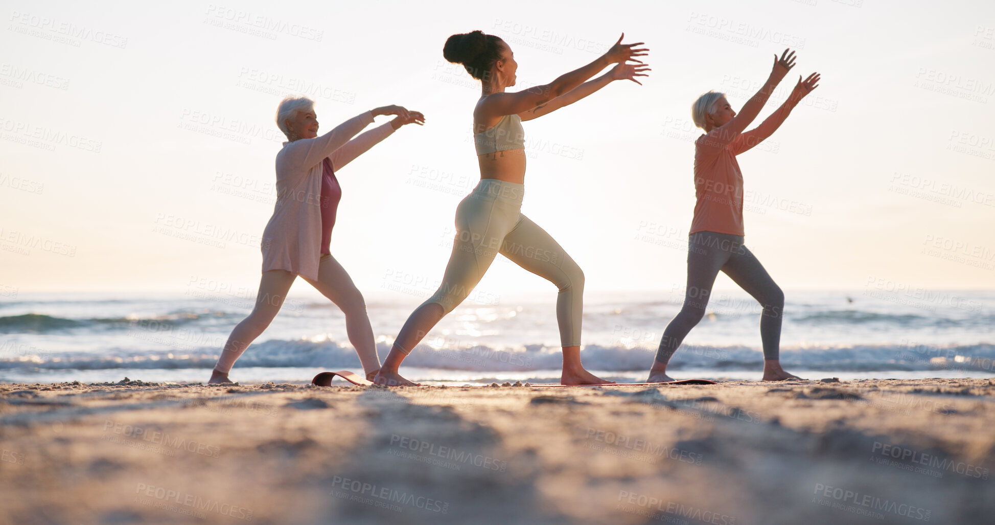 Buy stock photo Beach yoga class, sunset and meditation coach teaching breathing, mindfulness and spiritual chakra, aura or soul healing. Ocean waves, relax yogi and personal trainer coaching learning pilates group