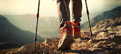 Closeup of hiking boots. trekking up a rocky mountain trail. Exploration and fitness