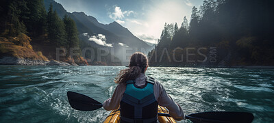 Kayak rear view of woman. Female kayaking and exploring in a river. Tourist and travel