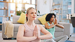 Yoga, meditation and women in home together, fitness and mindfulness training in living room. Balance, breathing and workout, friends in holistic exercise in peace and zen for health in apartment.