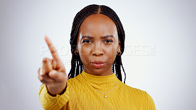 Buy stock photo No finger, black woman and angry portrait with protest, caution and wrong hand sign in a studio. Stop, white background and serious African female person with refuse, rejection and forbidden gesture