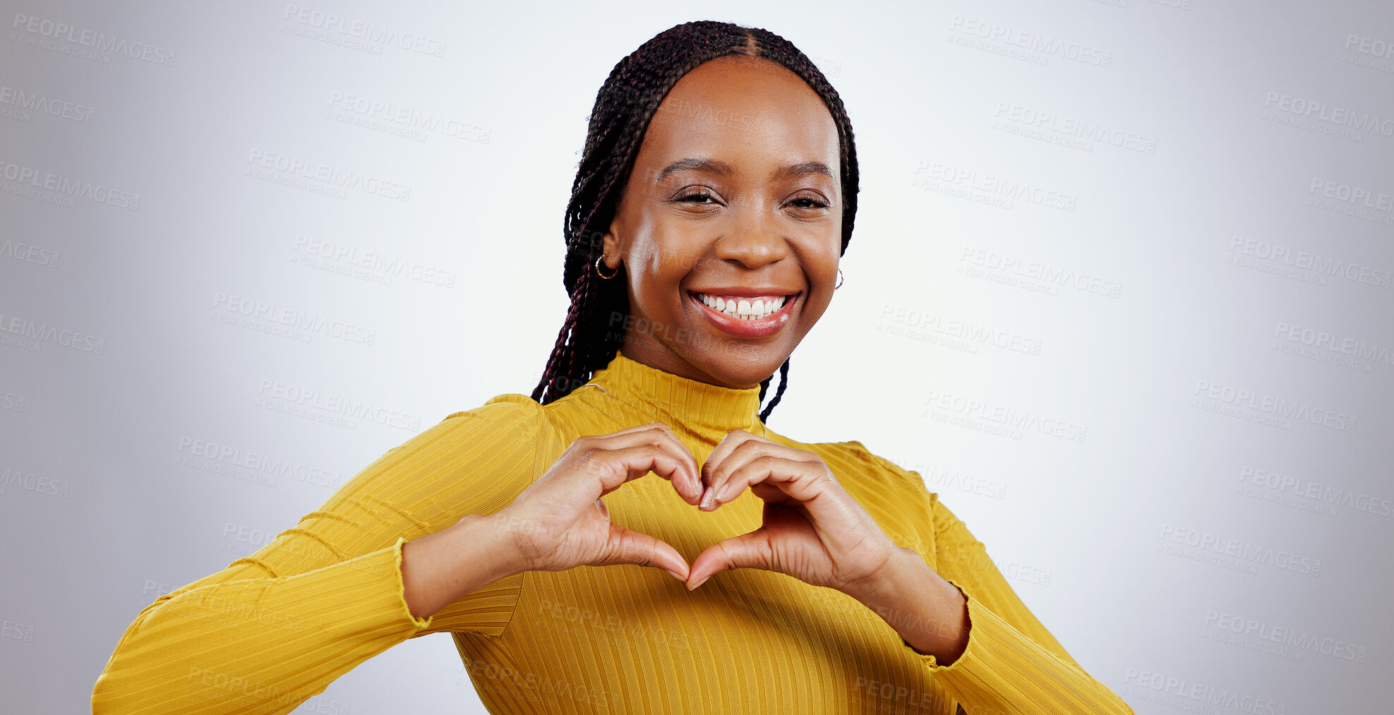 Buy stock photo Heart, hands and portrait of woman in studio for kindness, icon and charity donation on white background. Happy african model show sign of love, emoji and thank you for hope, support or care of peace