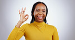 Portrait, smile and black woman with perfect hand in studio for feedback, support or motivation on grey background. Ok, emoji and face of lady model with vote success, thank you or review excellence
