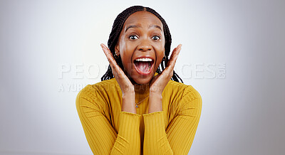 Buy stock photo Wow, news and hands on face of black woman in studio happy with competition, prize or bonus on grey background. Surprise, omg or portrait of African lady winner with mind blown emoji or lotto results