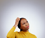 Thinking, solution and black woman in a studio with memory, brainstorming and planning facial expression. Guess, question and young African female model with confused face isolated by gray background