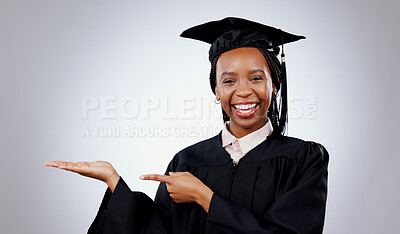Graduation, space or portrait of student pointing to education, college or university offer. Smile, black woman or happy graduate in studio for scholarship, promotion or mockup on grey background
