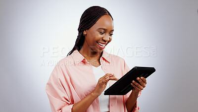 Buy stock photo Woman, student and tablet for online research, typing information or e learning registration in studio. Happy african person on digital technology for college or reading website on a white background