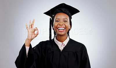 Graduation, okay hands and woman or student success in education, learning or college achievement in studio. Portrait of happy african graduate with yes or excellence emoji on a white background