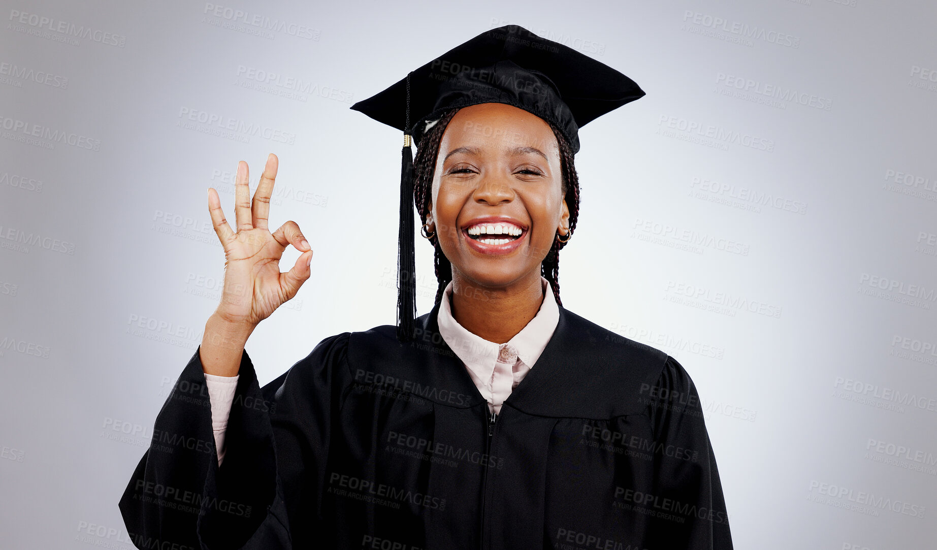 Buy stock photo Graduation, okay hands and woman or student success in education, learning or college achievement in studio. Portrait of happy african graduate with yes or excellence emoji on a white background