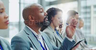 Businessman, meeting and hand up in seminar for question, interaction or idea at office conference. Group of business people or audience in team presentation or staff training for vote at workplace