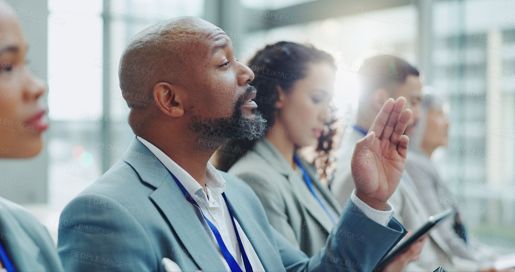 Buy stock photo Businessman, meeting and hand up in seminar for question, interaction or idea at office conference. Group of business people or audience in team presentation or staff training for vote at workplace