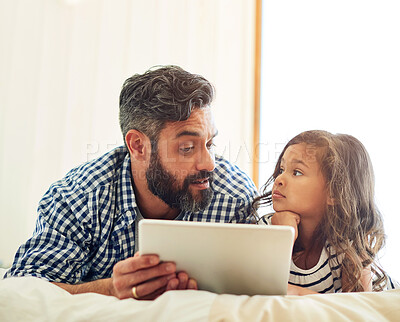 Buy stock photo Bed, digital tablet and daughter with father relax with reading, story and learning in their home together. Love, conversation and parent and girl relax in bedroom online for subscription service