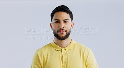 Buy stock photo Man, fashion and confidence in studio portrait for trendy style, beard and clothes by white background. Student guy, latino person and model with yellow golf tshirt for with cool aesthetic in Mexico