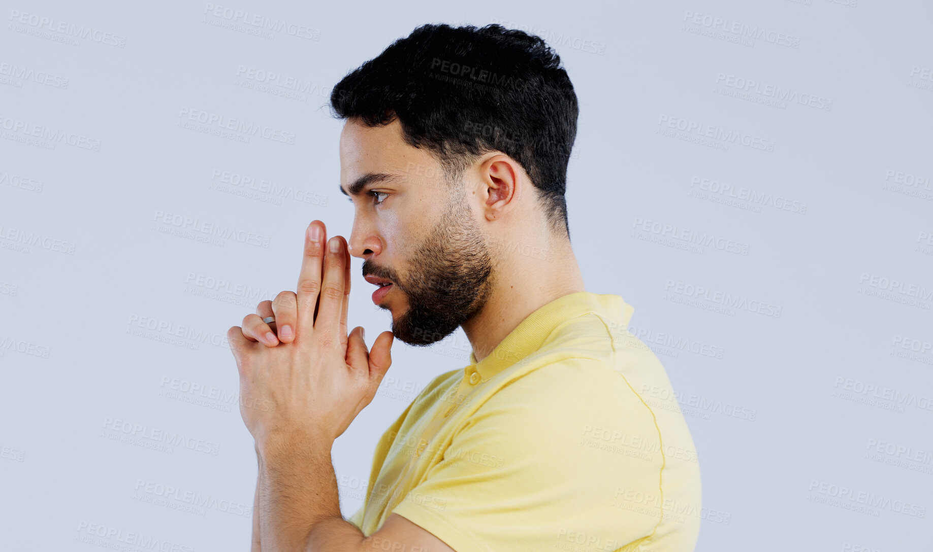 Buy stock photo Finger gun, pointing and profile of man in studio with aim for target, shooting and spy on blue background. Secret agent, mockup space and face of person with hand gesture for pistol or weapon