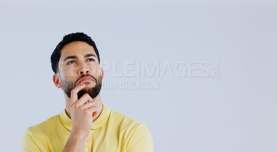 Buy stock photo Man, space and thinking of ideas in studio for planning insight, future decision and inspiration on mockup white background. Curious indian model brainstorming solution, remember memory and questions