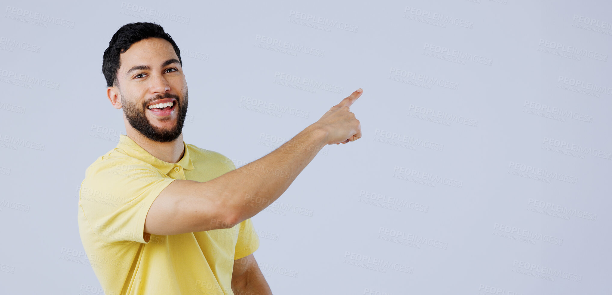 Buy stock photo Happy, man and portrait of pointing to space in studio for advertising information, deal and choice on white background. Indian model, presentation and mockup for feedback, promotion and announcement