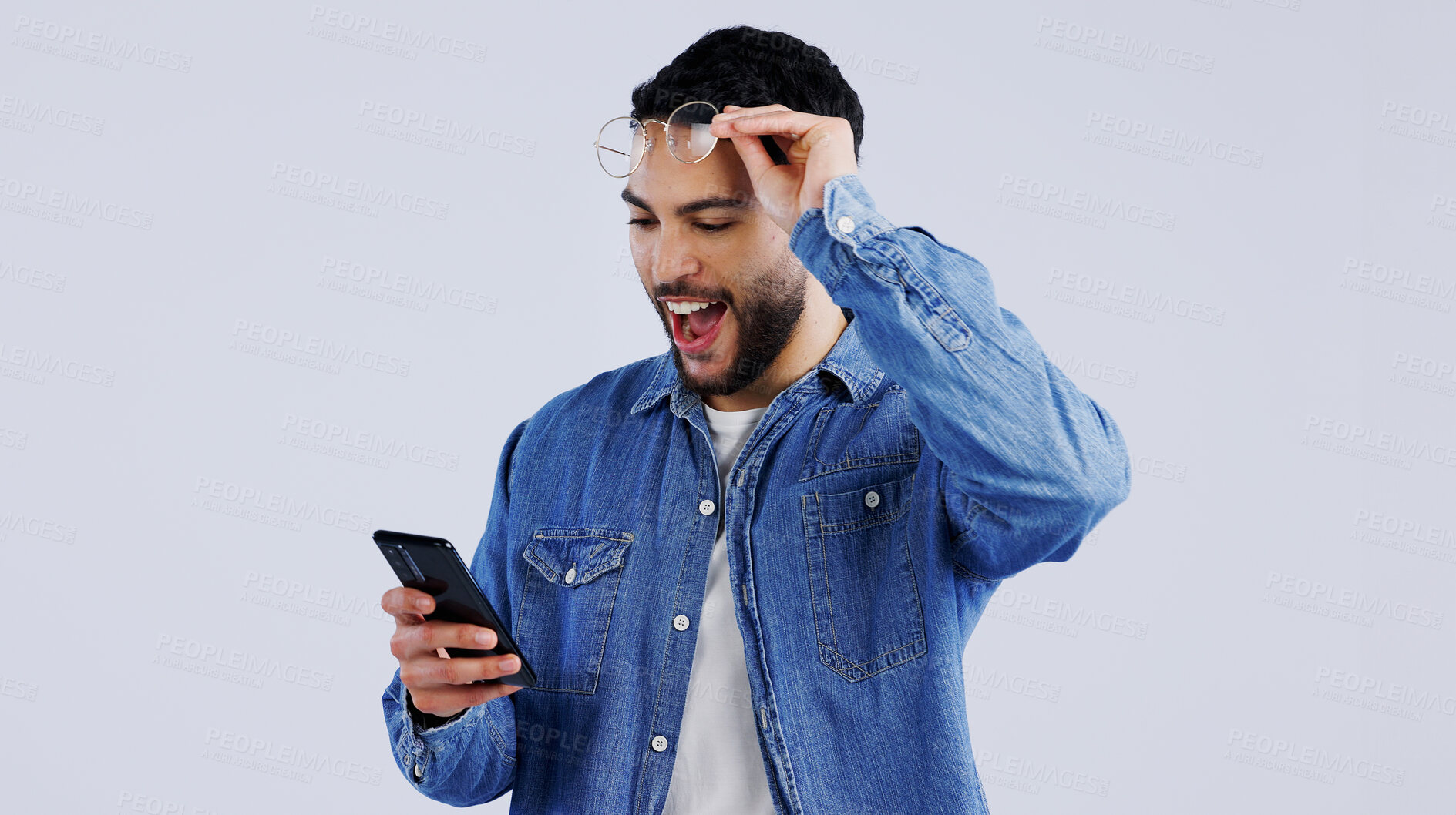 Buy stock photo Man, smartphone and excited with winner notification with surprise on technology, reward offer and white background. Young person, wow and digital news on cellphone, announcement and mockup space