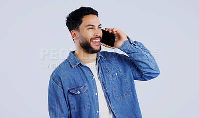 Buy stock photo Man, phone call and communication in studio for contact, networking and funny conversation on white background. Happy young indian model, mobile discussion and laugh for chat, talking and connection 