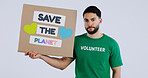 Volunteer man, poster and studio portrait to save the planet in global warming, crisis or ecology by background. Person, social responsibility and cardboard sign for sustainability for climate change