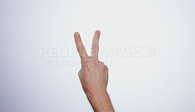 Hand, counting two and person in studio with mockup space for advertising, peace emoji, promotion or marketing. Fingers, closeup and man model with mathematics numbers gesture for empty mock up by white background.