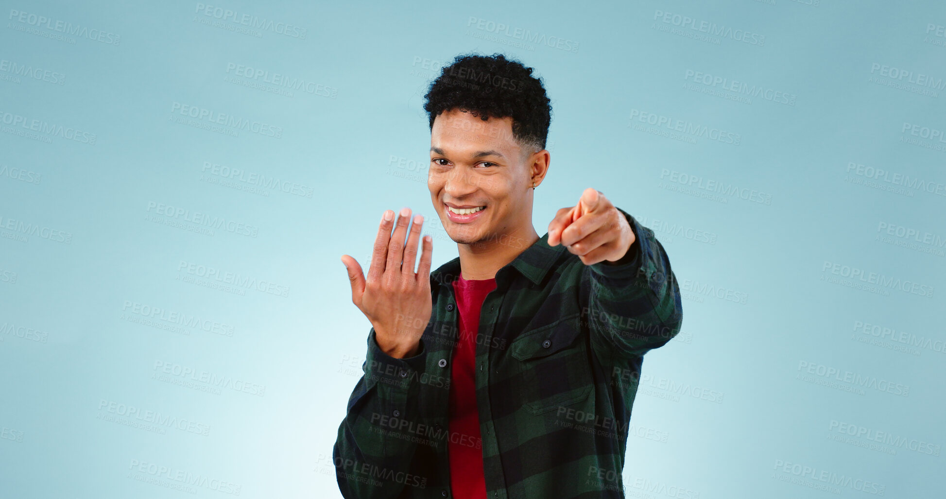 Buy stock photo Man, pointing and invitation for welcome in studio, offer and choice on blue background. Model, happy face and hand gesture for sign up in promotion, deal opportunity and advertising for mockup space
