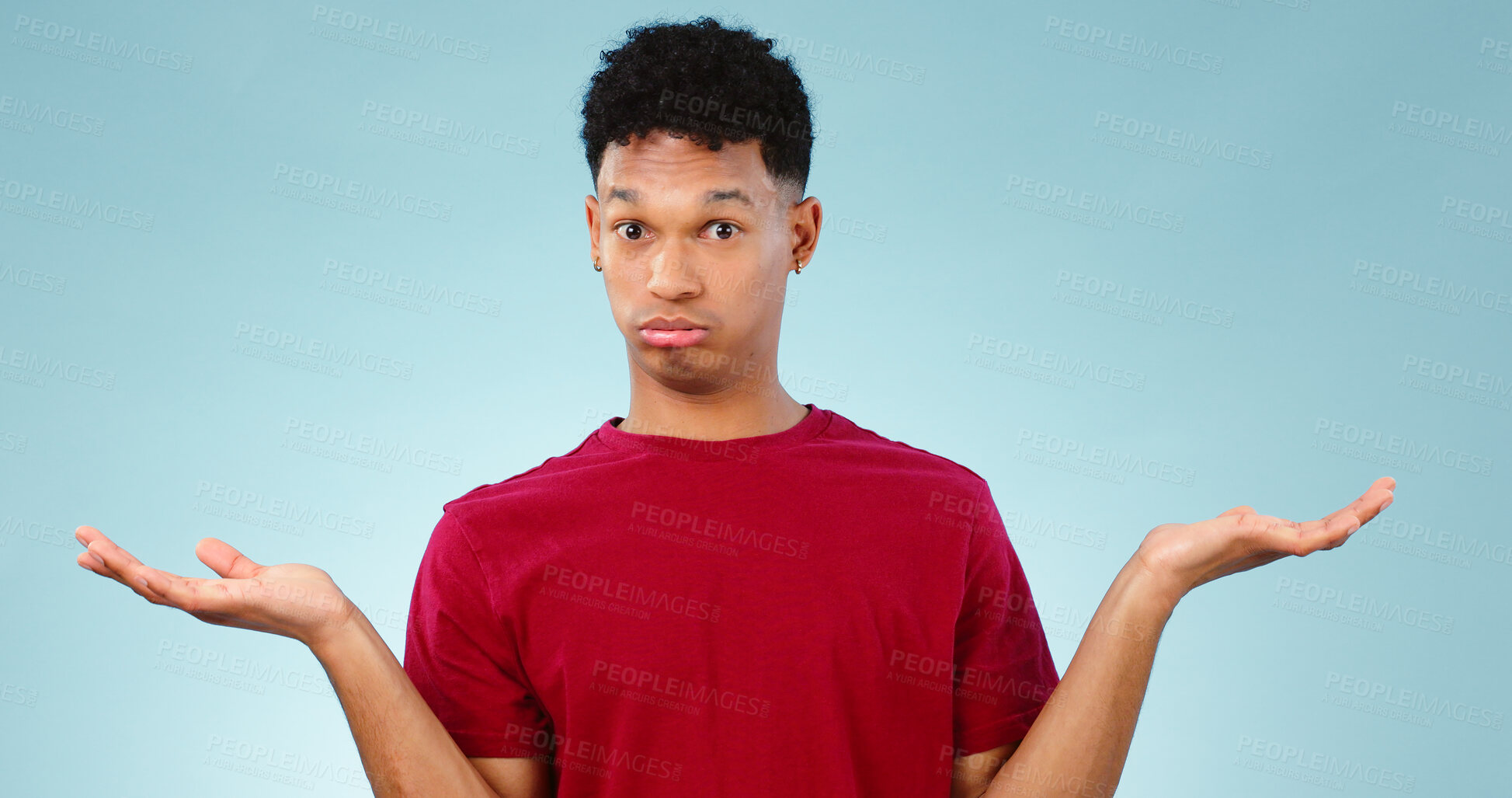 Buy stock photo Portrait, man and shrug for doubt in studio for promotion with mock up for option, decision or choice. Male model, face and unsure or confused with presentation, scale or deal on blue background