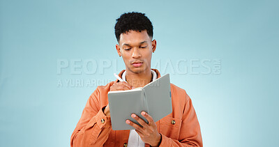 Buy stock photo Thinking, notebook and writing with man, problem solving and ideas with creativity on a blue background. Person, guy and model with planning, vision or education with decision, choice and knowledge