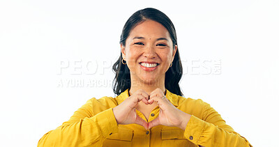 Buy stock photo Portrait, smile and heart hands with a young asian woman isolated on a white background in studio for love or health. Face, emoji and romance with a happy young korean girl on valentines day