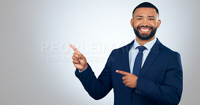 Buy stock photo Portrait, pointing and corporate businessman in studio with smile, deal announcement and mockup space. News, advice and happy man with choice, presentation or offer notification on white background.