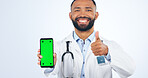 Phone, green screen and portrait of doctor with thumbs up, agreement or registration in white background. Studio, healthcare or sign for like, yes and ok mobile app for telehealth services or success