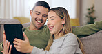 Couple, sofa and tablet with home, relax and happy with reading web blog, movie or funny meme in living room. Man, woman and digital touchscreen with comic laugh for social media post on lounge couch
