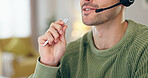 Closeup, person and mouth with headset for telemarketing, communication or customer care for remote work. Man, male call centre or agent with pen in hand for writing, report or document by consulting
