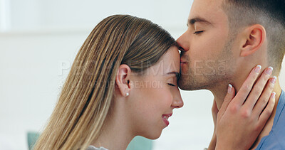 Buy stock photo Forehead, kiss and couple hug with love, support and connection, bonding and date in their home. Happy, care and people embrace in a house with trust, gratitude or sweet, relationship or security