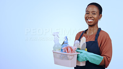 Buy stock photo Woman, portrait and smile in studio for cleaning service, housekeeping or home improvement on blue background. Black person, face and happy with holding bucket, product or detergent on mock up space