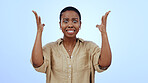 Portrait, black woman and surprise with announcement, shocked and facial expression on a blue background. Face, African person and model with reaction, emoji and mockup space with emotion, wow or omg