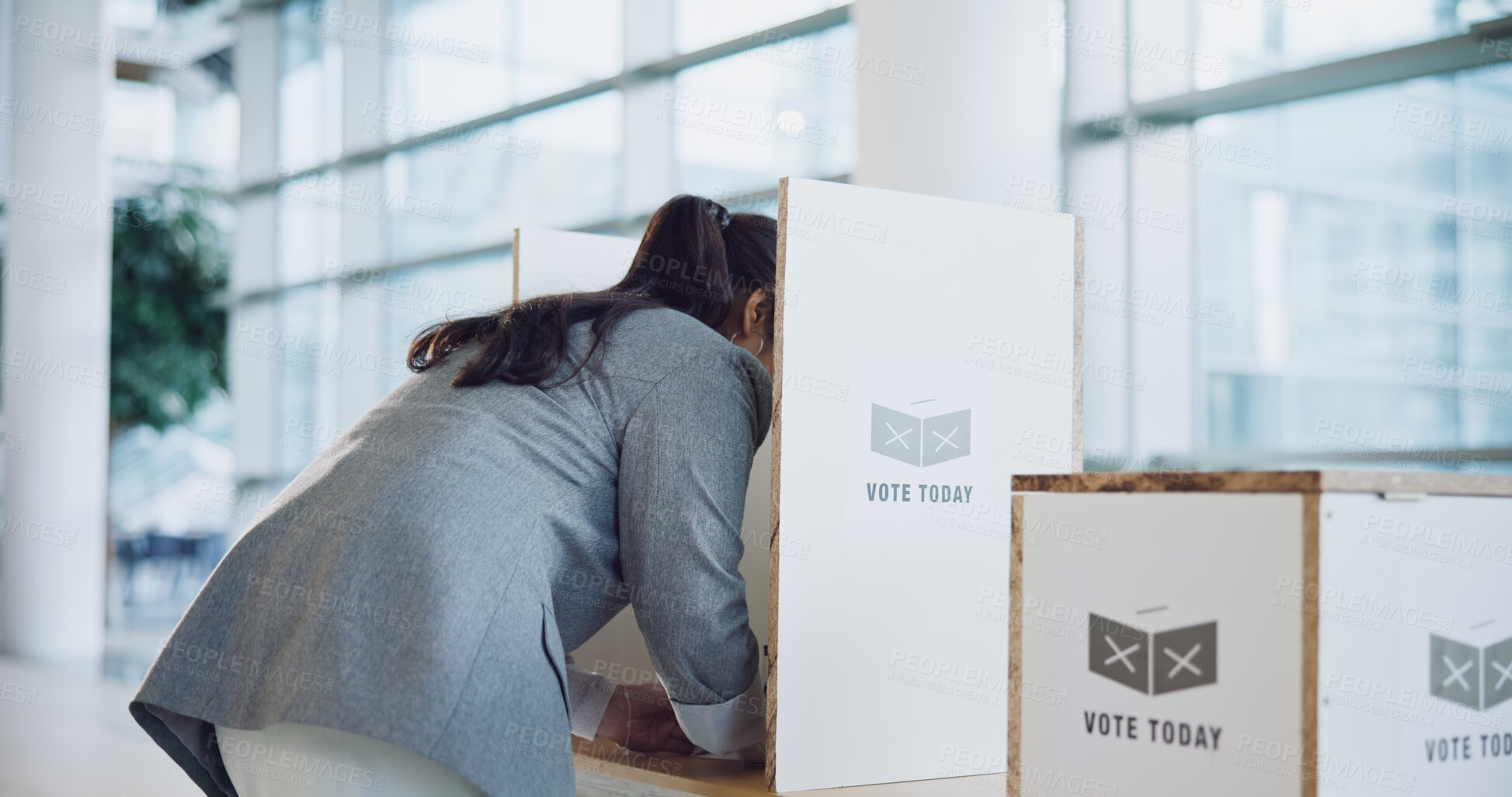 Buy stock photo Vote booth, election and woman at station for politics, freedom in democracy or human rights. Polling, back and person at ballot for choice, equality or decision of government, party or state patriot