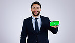 Professional man, mobile green screen and space for social media, software or online subscription in studio. Portrait of business worker on phone, website mockup or contact info on a white background