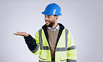 Happy man, architect and palm for advertising or marketing against a gray studio background. Male person, contractor or engineer smile with hard hat and hand out for deal or service in construction