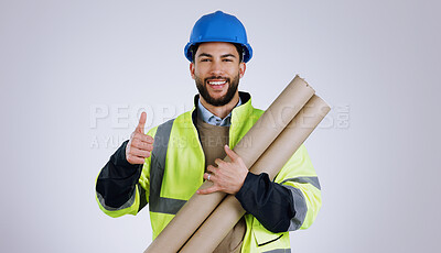 Buy stock photo Engineering, man and thumbs up for architecture success, renovation and design planning with blueprint in studio. Portrait of construction worker or contractor with like emoji on a white background
