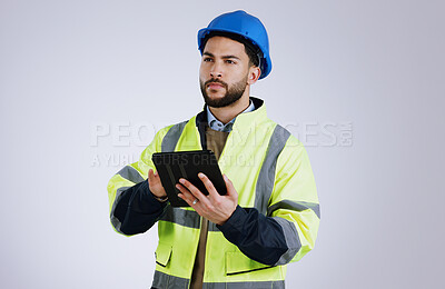 Buy stock photo Engineering, man and tablet for inspection, thinking of renovation or project management on a white background. Construction worker for architecture survey, planning and digital technology in studio