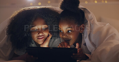 Sisters, girl or tablet at night with internet for movie, cartoon or streaming with blanket on bed in bedroom. Family, kids or children with technology in the dark for film, video and bonding at home