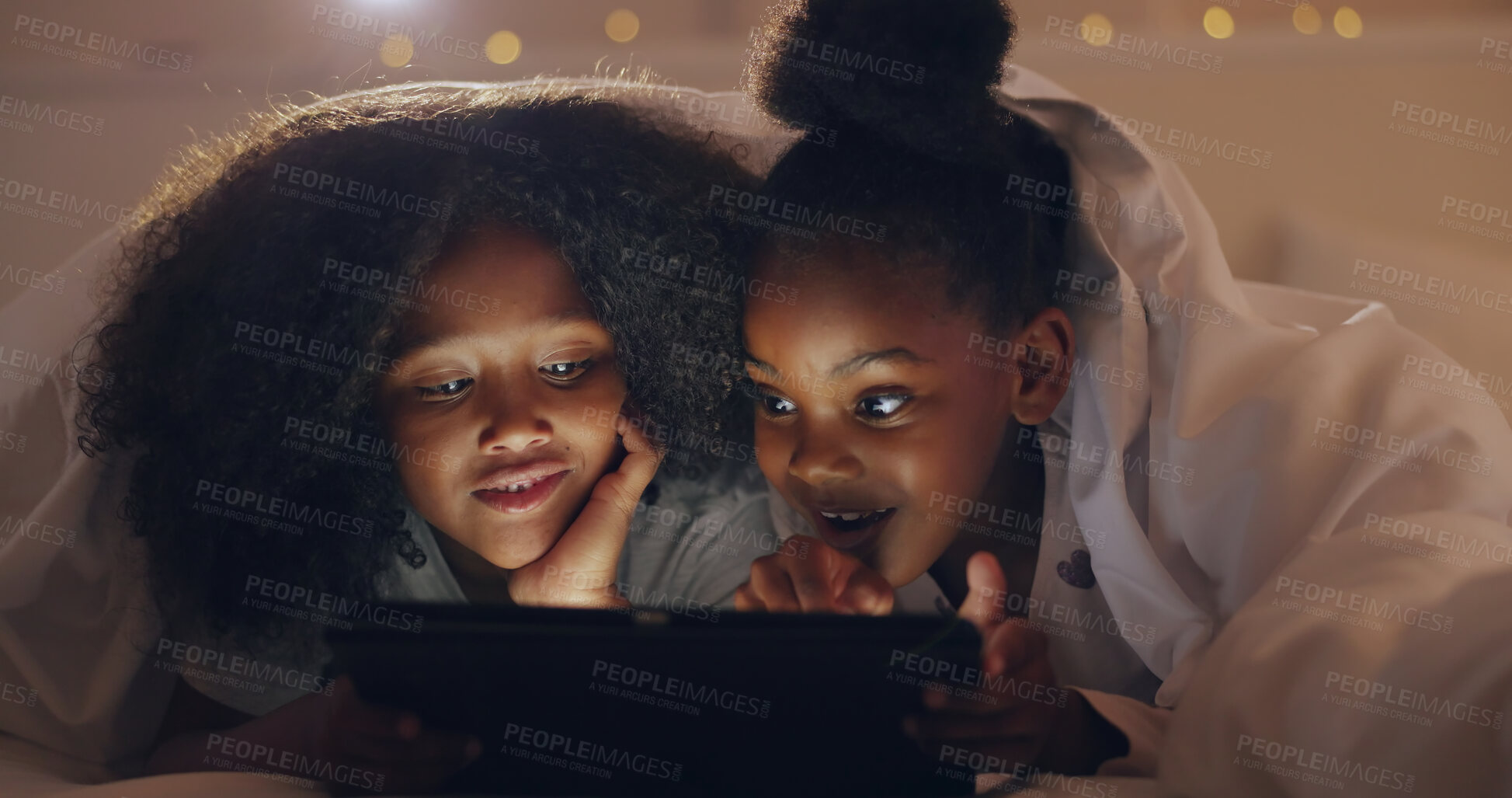 Buy stock photo Sisters, girl or tablet at night with internet for movie, cartoon or streaming with blanket on bed in bedroom. Family, kids or children with technology in the dark for film, video and bonding at home