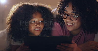 Mother, daughter and tablet at night with internet for movie, cartoon or streaming with blanket on bed in bedroom. Family, woman and girl child with technology in the dark for film, video and bonding