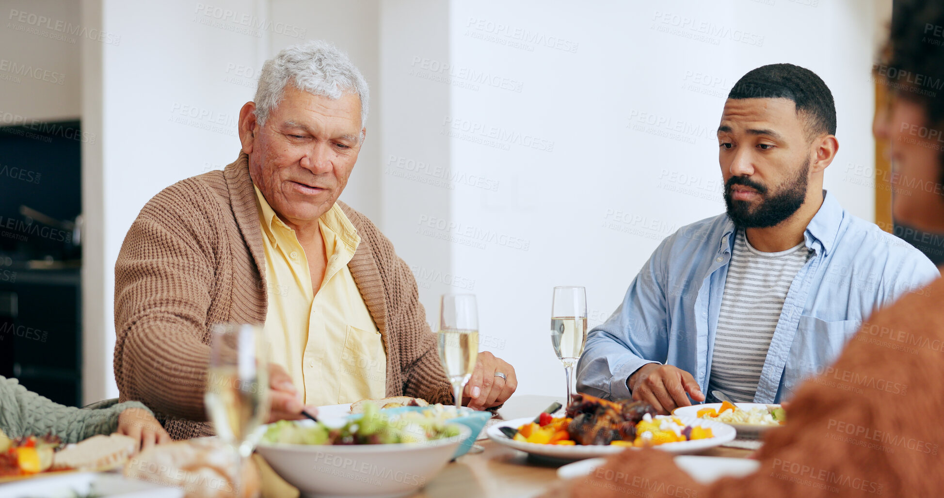 Buy stock photo Food, holidays and a family at the dinner table of their home together for eating a celebration meal. Love, thanksgiving and a group of people in an apartment for festive health, diet or nutrition