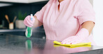 Cleaning, woman or spray on kitchen counter with detergent, housekeeper or service for home hygiene. Hands, person and cloth in housekeeping to shine, sanitizer and disinfectant for surface in house