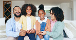 Happy family in portrait with kids on sofa in home, bonding together for love or memory. Mother, father and girl children on couch in living room with trust, support or smile, relax with mom and dad 