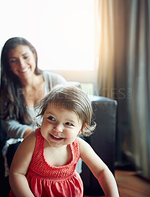 Buy stock photo Cute, happy and baby playing with mother, bonding and relaxing in the living room of a house. Relax, smile and playful child laughing with happiness during quality time in their family home with mom