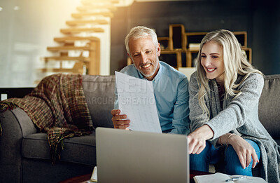 Buy stock photo Cropped shot of a couple going through their paperwork together at home