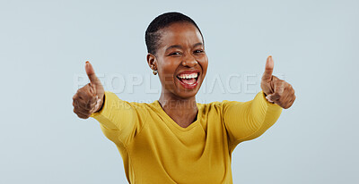 Buy stock photo Happy black woman, portrait and thumbs up in winning or good job against a gray studio background. African female person smile with like emoji, yes sign or OK in thank you for approval or success